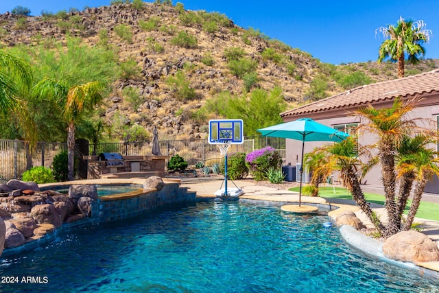9845 E Inglewood St, Mesa, AZ 85207 - view of pool with an in ground hot tub, a grill, fence, central air condition unit, and a mountain view