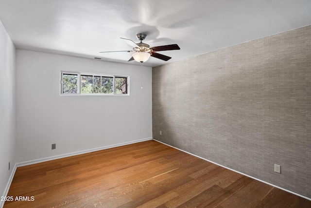 235 El Camino Grande, Sedona, AZ 86336 - unfurnished room with wood finished floors, ceiling fan, and baseboards