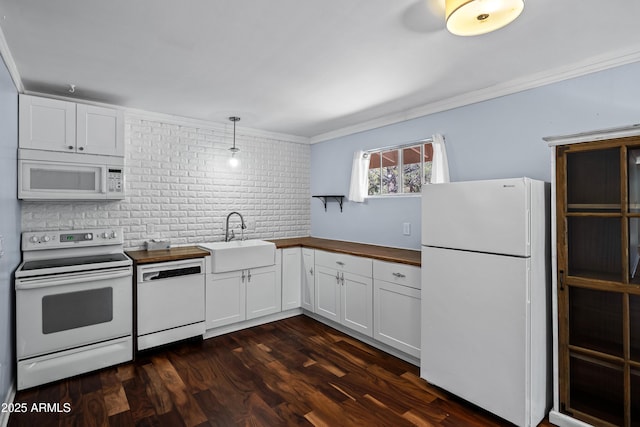 235 El Camino Grande, Sedona, AZ 86336 - kitchen with white appliances, a sink, ornamental molding, white cabinets, and tasteful backsplash