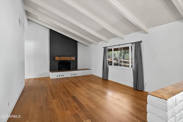 235 El Camino Grande, Sedona, AZ 86336 - unfurnished living room featuring a fireplace, wood finished floors, and baseboards