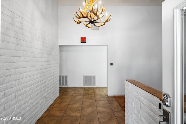 235 El Camino Grande, Sedona, AZ 86336 - hallway featuring a chandelier and dark tile patterned flooring