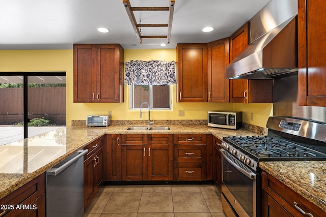 235 El Camino Grande, Sedona, AZ 86336 - kitchen with stainless steel appliances, a sink, wall chimney exhaust hood, recessed lighting, and light tile patterned floors