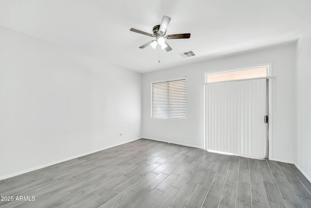 7207 W Alta Vista Rd, Laveen, AZ 85339 - empty room featuring ceiling fan and wood finished floors