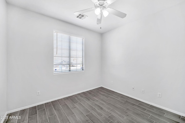 7207 W Alta Vista Rd, Laveen, AZ 85339 - spare room featuring wood tiled floors and a ceiling fan