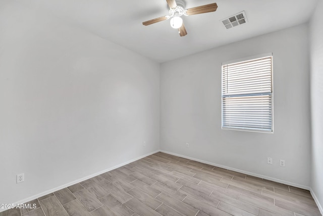 7207 W Alta Vista Rd, Laveen, AZ 85339 - unfurnished room featuring a ceiling fan and wood finish floors