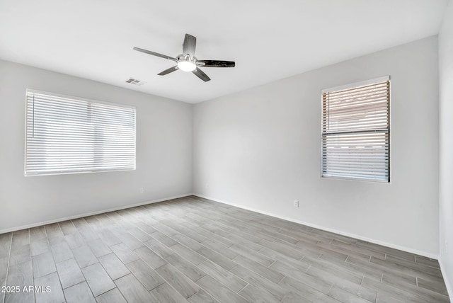 7207 W Alta Vista Rd, Laveen, AZ 85339 - spare room with ceiling fan and wood finished floors