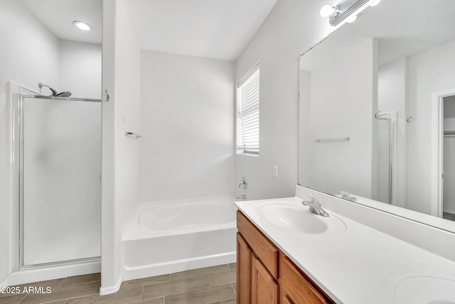 7207 W Alta Vista Rd, Laveen, AZ 85339 - full bathroom featuring a shower stall, double vanity, a bath, and wood finish floors
