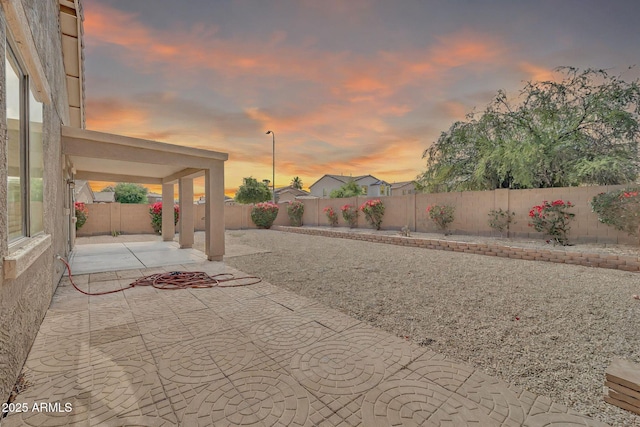7207 W Alta Vista Rd, Laveen, AZ 85339 - fenced backyard featuring a patio area