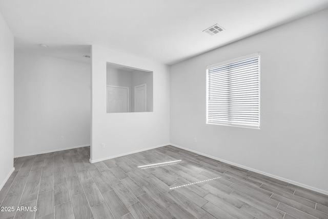 7207 W Alta Vista Rd, Laveen, AZ 85339 - empty room with wood finish floors and baseboards