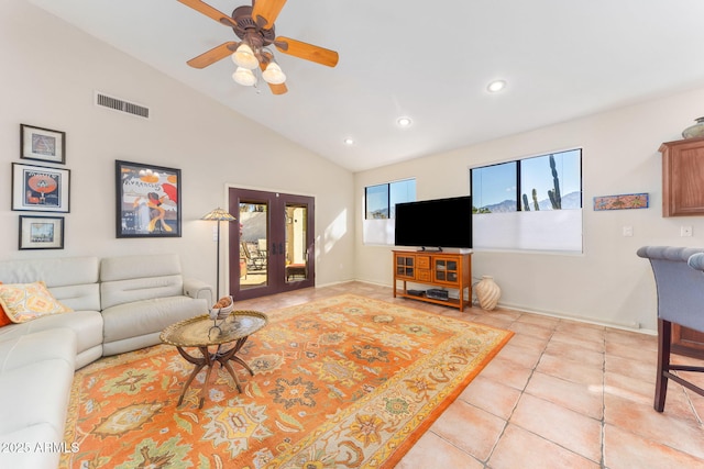 living room with light tile patterned floors, high vaulted ceiling, french doors, and ceiling fan