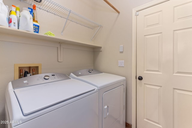 laundry room with washing machine and clothes dryer