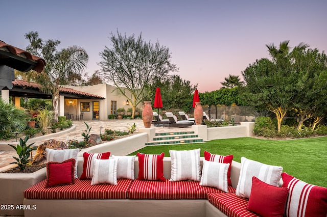 exterior space with an outdoor living space and a yard