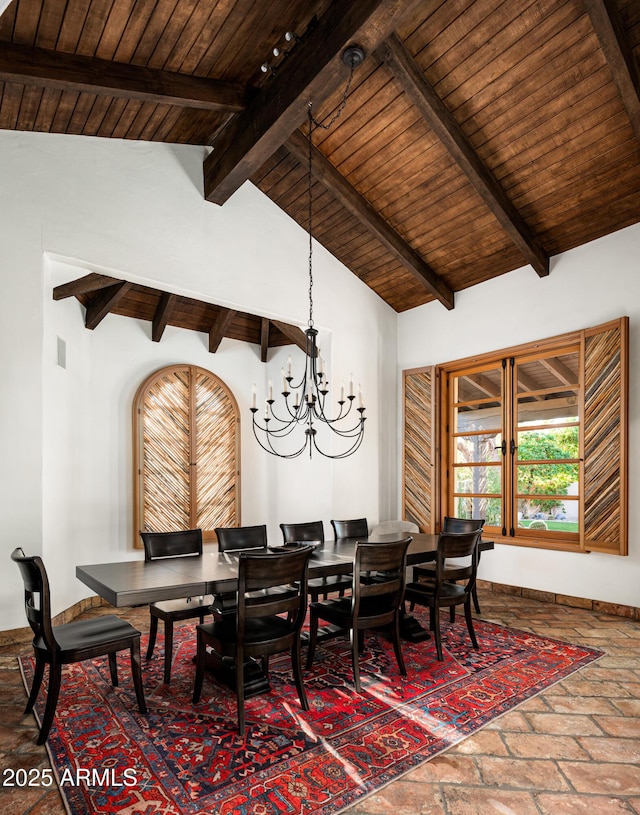 dining space with a chandelier, wooden ceiling, lofted ceiling with beams, and brick floor