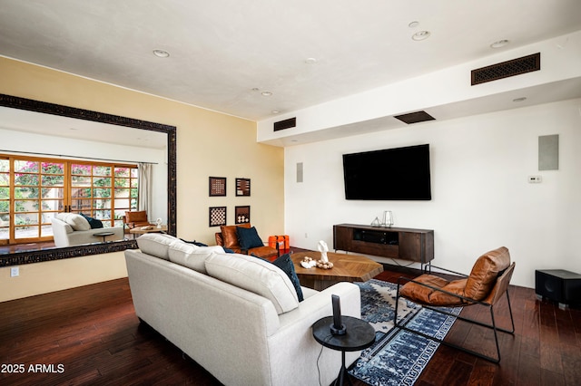 living area with visible vents, recessed lighting, and dark wood-style floors