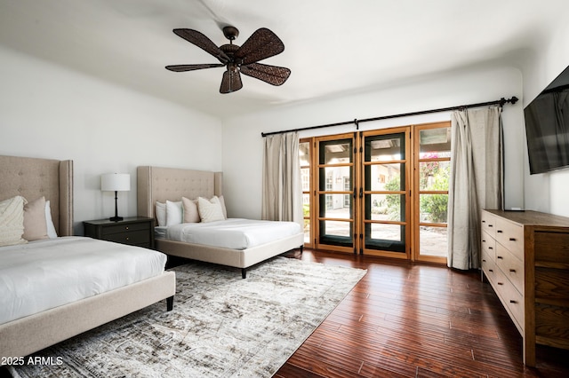 bedroom with ceiling fan and dark wood-type flooring