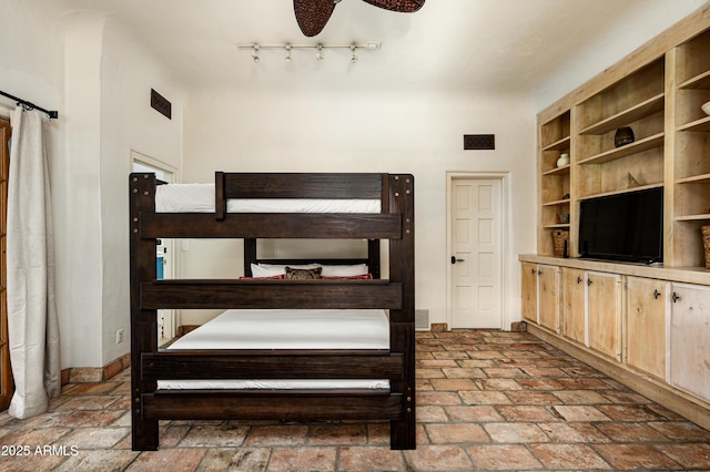bedroom featuring visible vents and baseboards