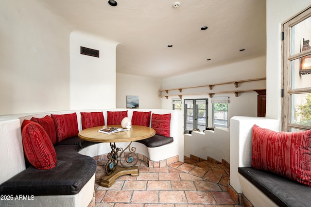 interior space featuring visible vents, stone finish floor, and french doors