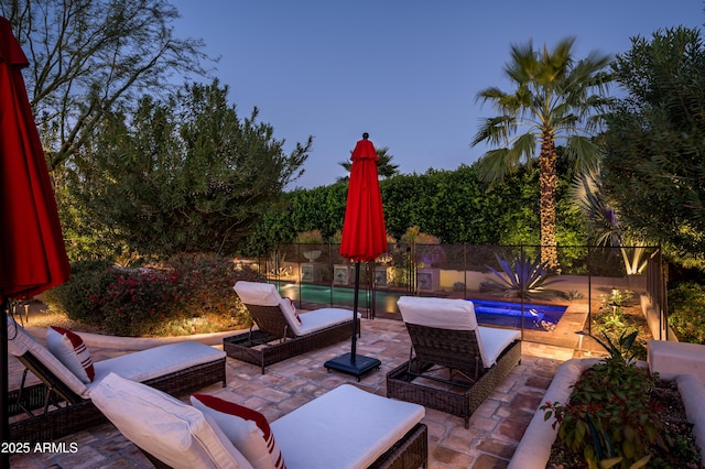 view of patio / terrace featuring a fenced backyard and a fenced in pool