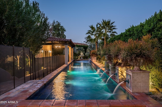 view of pool with fence and a fenced in pool