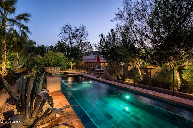 view of swimming pool with fence and a fenced in pool