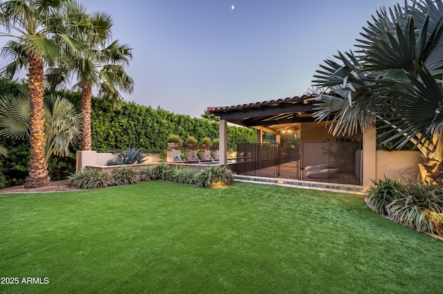 view of yard with a fenced in pool