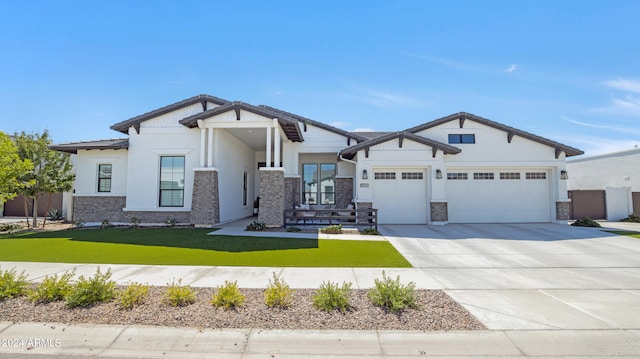 view of front facade with a garage and a front yard