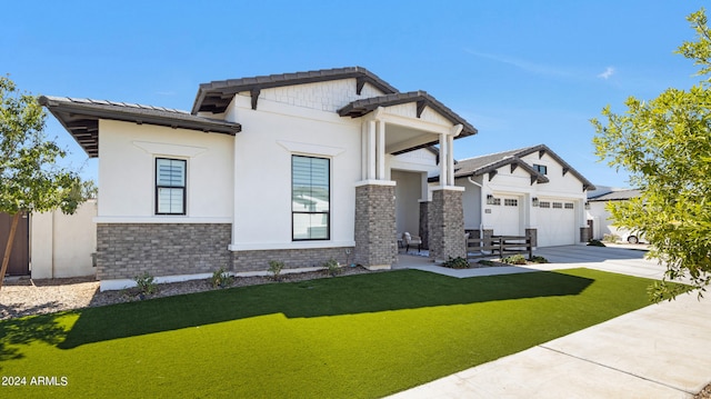 craftsman house with a garage and a front yard