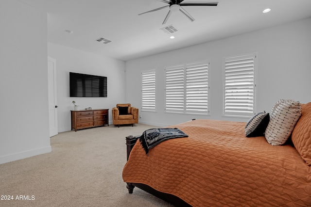 bedroom with ceiling fan and light colored carpet