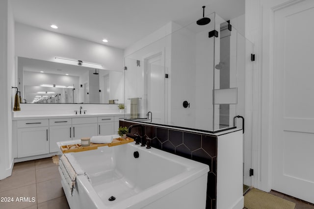 bathroom featuring backsplash, tile patterned flooring, vanity, and separate shower and tub