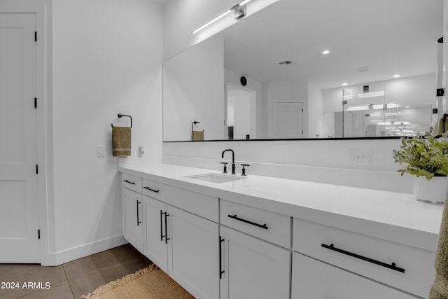 bathroom with vanity and tile patterned floors