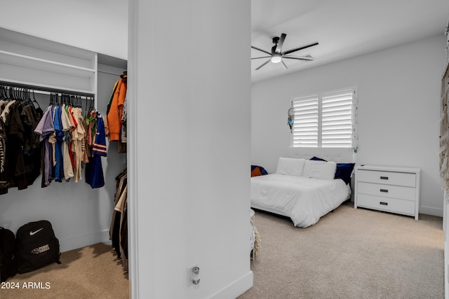 bedroom with ceiling fan and light colored carpet