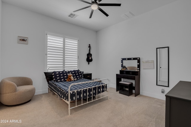 bedroom featuring ceiling fan and light colored carpet