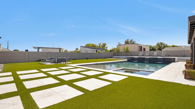 view of pool featuring a lawn and a patio