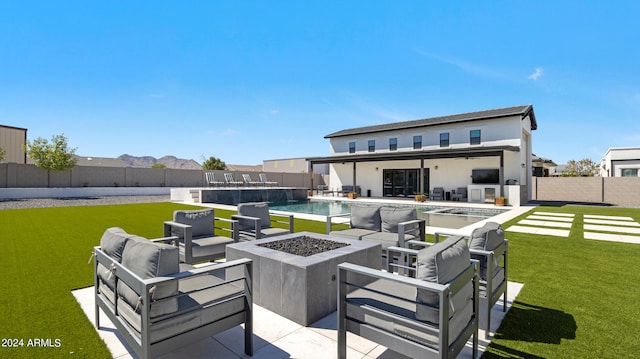 view of patio featuring an outdoor living space with a fire pit