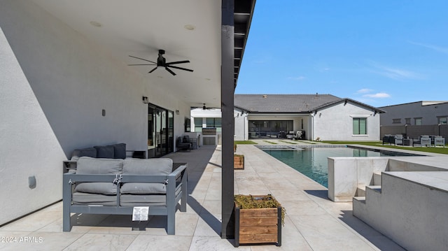 view of swimming pool featuring outdoor lounge area, ceiling fan, and a patio area