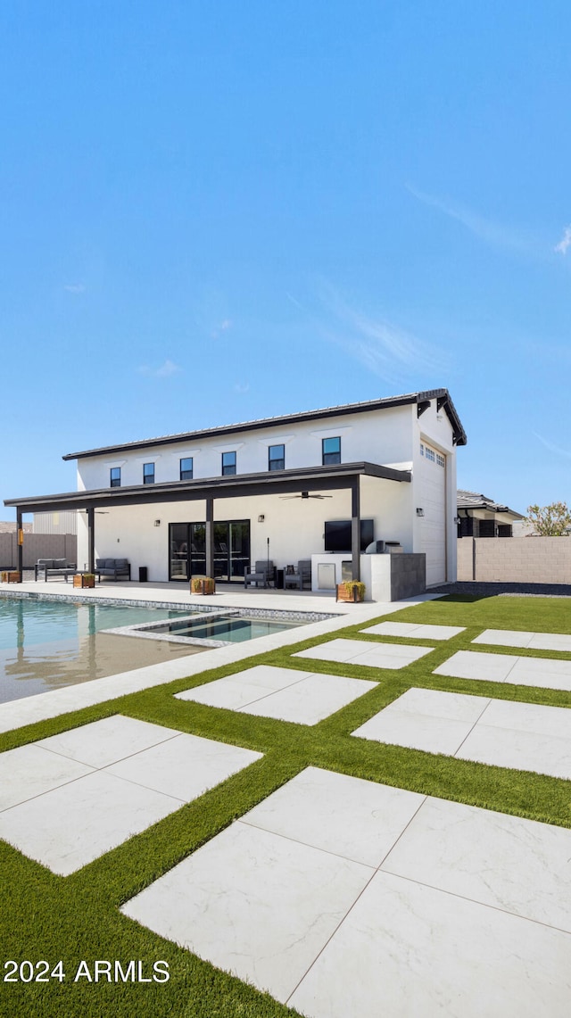 view of front facade with a fenced in pool and a patio area