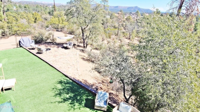 birds eye view of property with a forest view