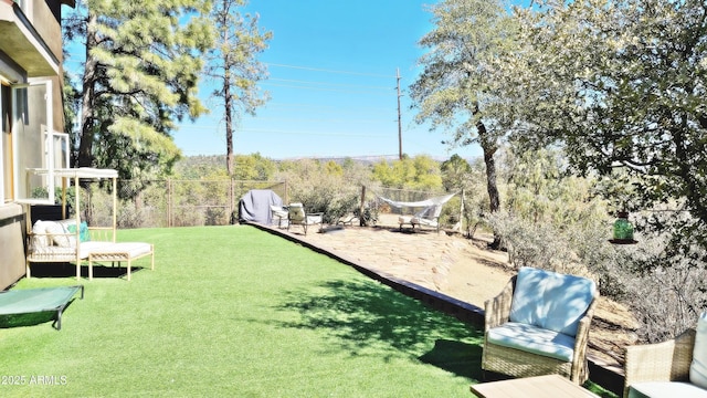 view of yard with a patio and fence