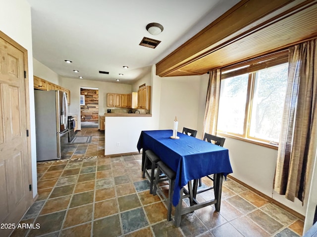 dining area with visible vents, stone finish floor, and recessed lighting