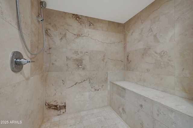 full bathroom with tiled shower