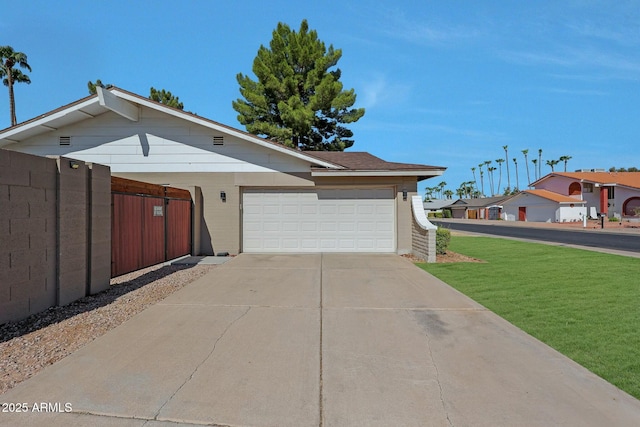 ranch-style house with an attached garage, brick siding, fence, driveway, and a front yard
