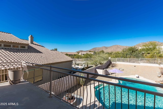 balcony featuring a mountain view