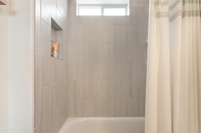 bathroom with shower / tub combo