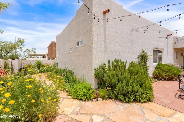 view of property exterior featuring a patio area