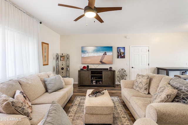 living room with ceiling fan, a healthy amount of sunlight, and dark hardwood / wood-style flooring