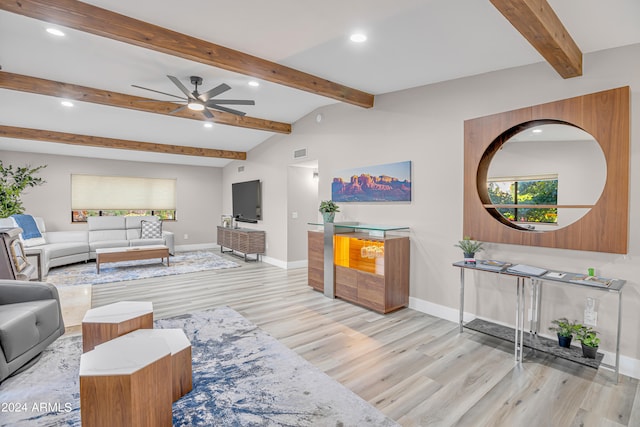 living room with light wood-type flooring, vaulted ceiling with beams, and ceiling fan