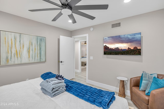 bedroom featuring ceiling fan and hardwood / wood-style flooring