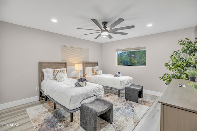 bedroom featuring light hardwood / wood-style flooring and ceiling fan