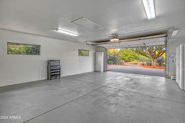 garage featuring white fridge