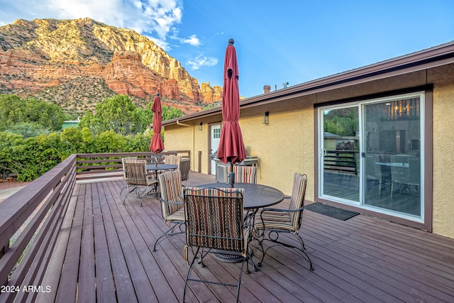 wooden deck with a mountain view